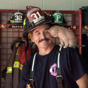 HE PULLED HER OUT OF A BURNING BUILDING—AND THEN SHE NEVER LEFT HIS SHOULDER